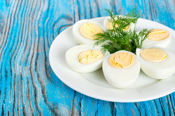 Boiled hen eggs and green dill