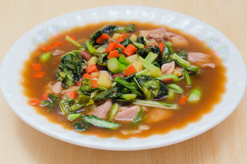 Mixed vegetable and herb in oyster sauce and herb (famous thai f