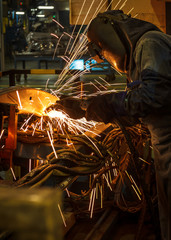 Industrial steel welder in factory