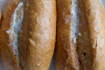 freshly baked white bread French with butter