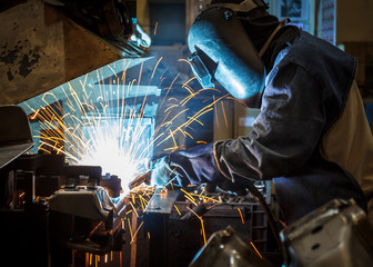 Industrial steel worker speeds motion in factory