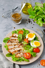 Chicken salad with leaf vegetables and cherry tomatoes