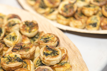 Obraz na płótnie Canvas Vegetables pastry small tarts on plates on appetizer catering restaurant