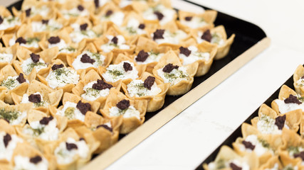 Many yellow veggies small tarts food close up