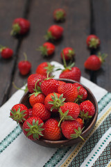 Fresh strawberries on old wooden background