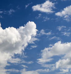 Clouds fairytale in deep blue sky