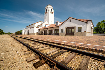 Fototapeta na wymiar Classic train Depot and train tracks