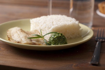 white fish and rice with pesto