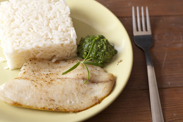white fish and rice with pesto