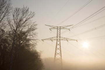 Fototapeta na wymiar Electricity Pylon in Mist