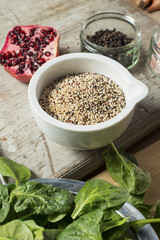 Obraz na płótnie Canvas Cooking Ingredients for Spinach, Pomegranate, Quinoa Salad
