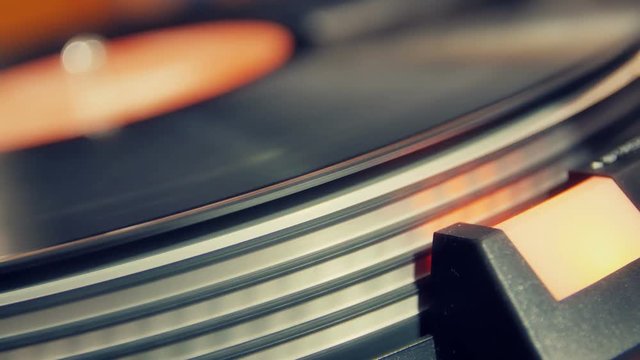 close up of vintage old vinyl record playing on a turntable player