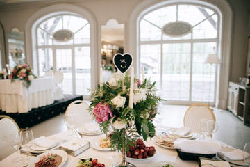 Hand Made Wedding Decoration, flowers, wood. Gorgeous white restaurant for the wedding celebration