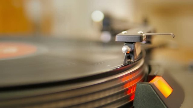 old vintage record playing,stylus needle going down