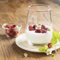 Natural yogurt with fresh strawberries for breakfast