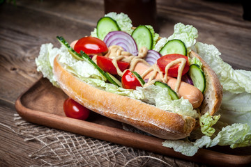 Homemade sandwich on a wooden table.
