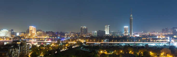 Panoramic view of central Cairo skyline at night - obrazy, fototapety, plakaty