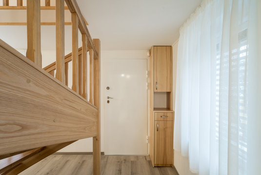 Modern interior. A wooden staircase in the interior of the house
