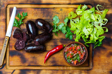 Homemade blood sausage. Prieta de sangre on wooden board