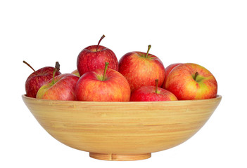 A bowl with fresh red apple on the white background 