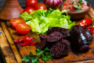 Homemade blood sausage. Prieta de sangre on wooden board