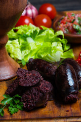 Homemade blood sausage. Prieta de sangre on wooden board