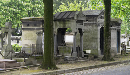 Naklejka premium Religious family crypts and monuments in european graveyard