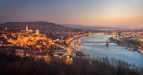 Fototapeta na wymiar Panoramic View of Budapest and the Danube River as Seen from Gellert Hill Lookout Point. Smooth Transition Between Night and Day
