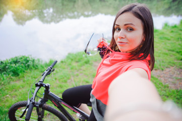Girl doing selfie on cycling