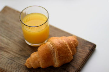 Orange juice and croissant
