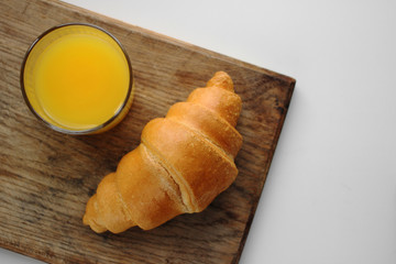 Orange juice and croissant
