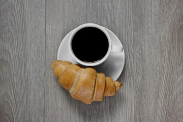 cup of coffee and croissant
