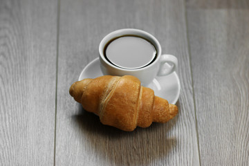cup of coffee and croissant
