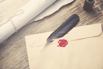 Old feather, envelope, sealing wax