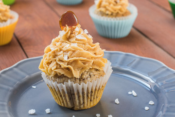 Detail on a Muffin with Caramel and Sea Salt on a Gray Plate