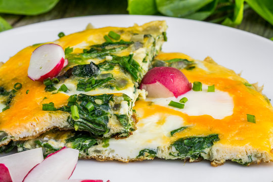 Spinach Omelette with Radish on a White Plate