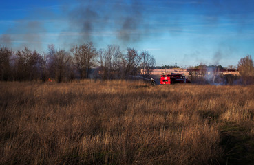 Fototapeta premium fire truck to put out a forest fire. firefighters to extinguish