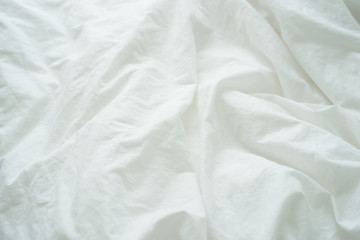 Bed sheet or blanket with wrinkle.