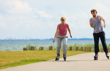 Fototapeta premium Teen couple together on skates.