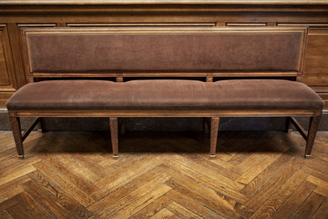 Fototapeta na wymiar Velvet bench and wooden floor