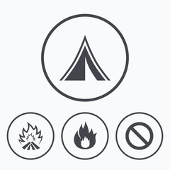 Fototapeta premium Tourist camping tent sign. Fire flame icons.