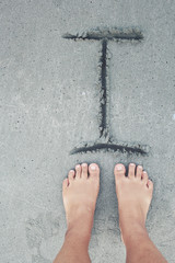 Selfie of foot with word I written on beach