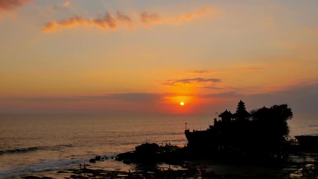 sea balinese temple tanah lot bali indonesia at the sunset sun reflection on the sea