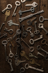 Set of keys on wood background