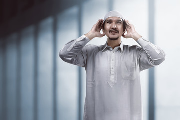 Muslim man doing adzan