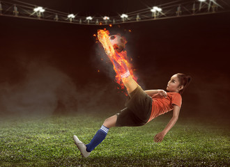 Fototapeta na wymiar Football player kick fire ball on the stadium