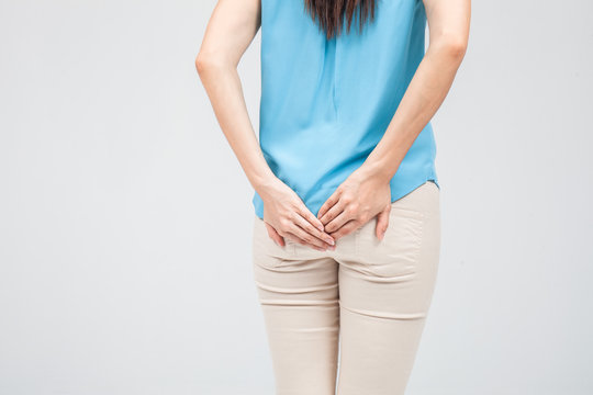 Woman has Diarrhea Holding her Butt: Isolated on White Backgroun