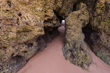 Sea caves on the beach of Praia da Rocha, Portimao Coast. Algarve region. Portugal