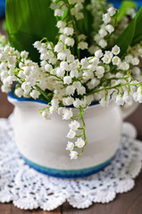 Bouquet of Lily of the valley flowers, selective focus, toned image