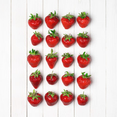 Strawberries on white wood